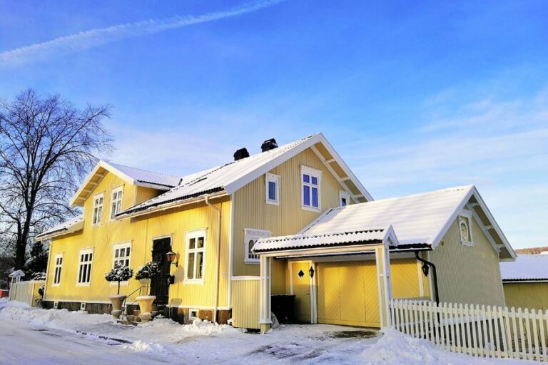 A snow-covered Canadian home prepared for heavy snowfall, highlighting essential safety measures for winter storms and blizzards.